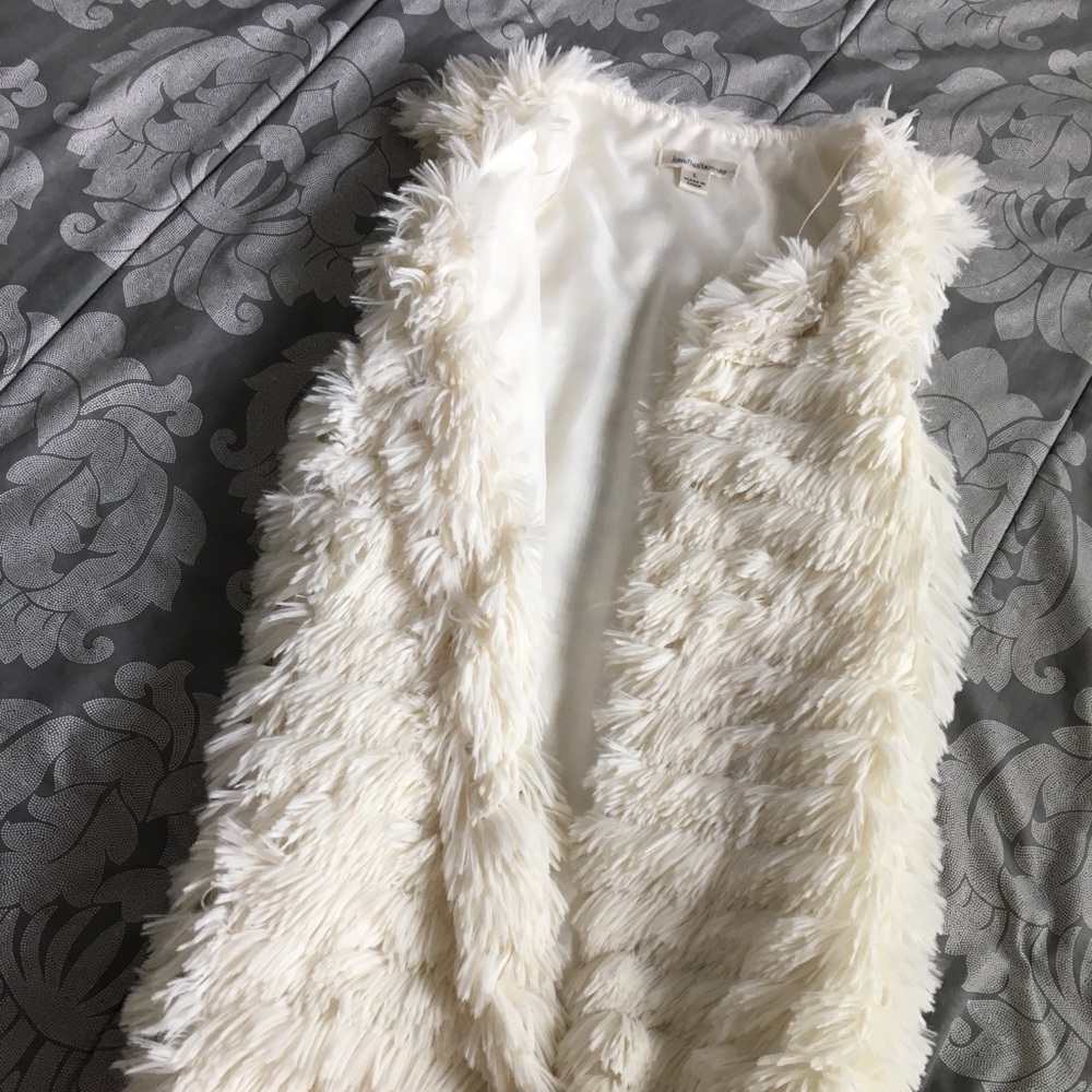 White fur vest
